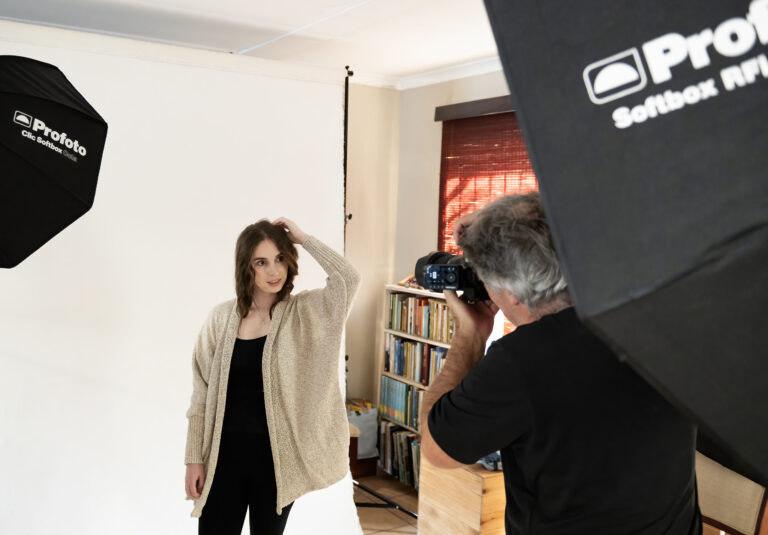 Behind the scenes of Emil Bosch photographing a portrait client in the studio.