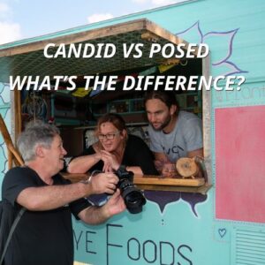 emil showing a couple a photograph taken of their food truck at an event.