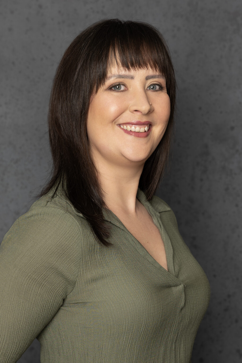 Corporate headshot of a businesswoman photographed in the Emil Bosch Photography studio in Blouberg