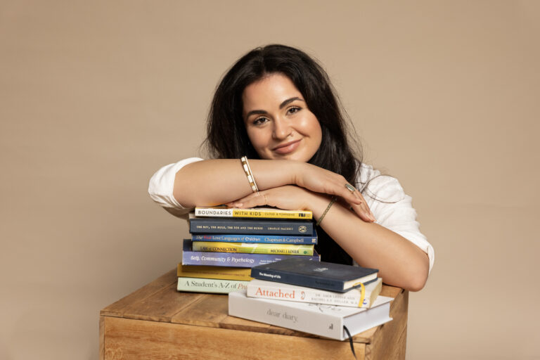 professional counsellor leaning on academic books