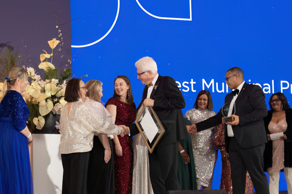 prize winners on stage receiving their award from Alan Winde