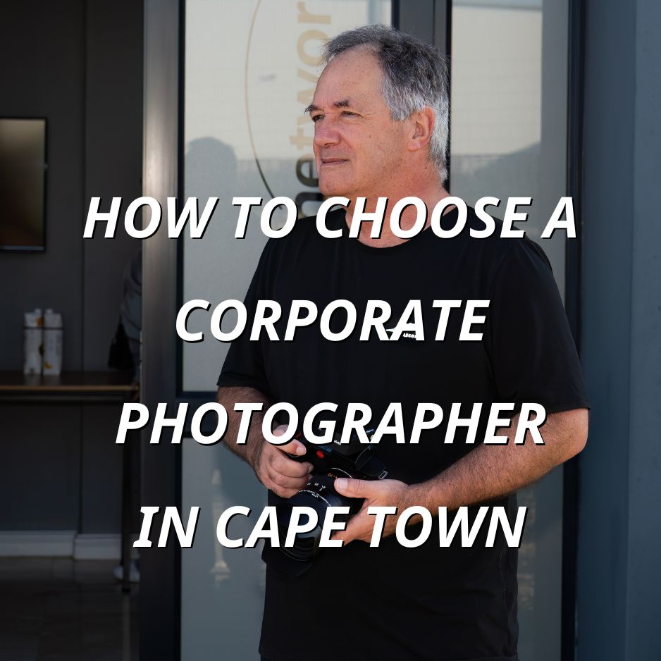 Corporate photographer holding a camera on location in Cape Town