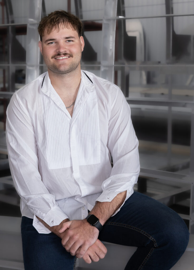 on-site headshot of a staff member from a yacht builder