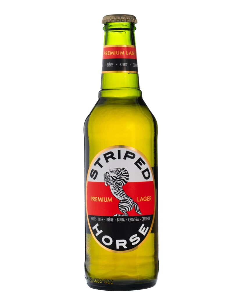 Striped Horse Premium Lager bottle photographed on a white background for e-commerce